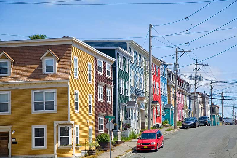 multicoloured buildings lined up on a street