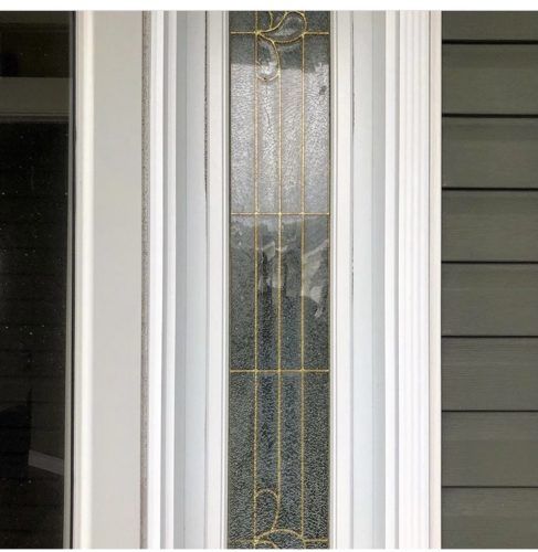 glass door with gold accent lines and white trim